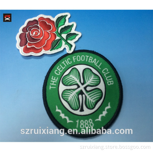 Adhesive pellon backing embroidered border woven patch